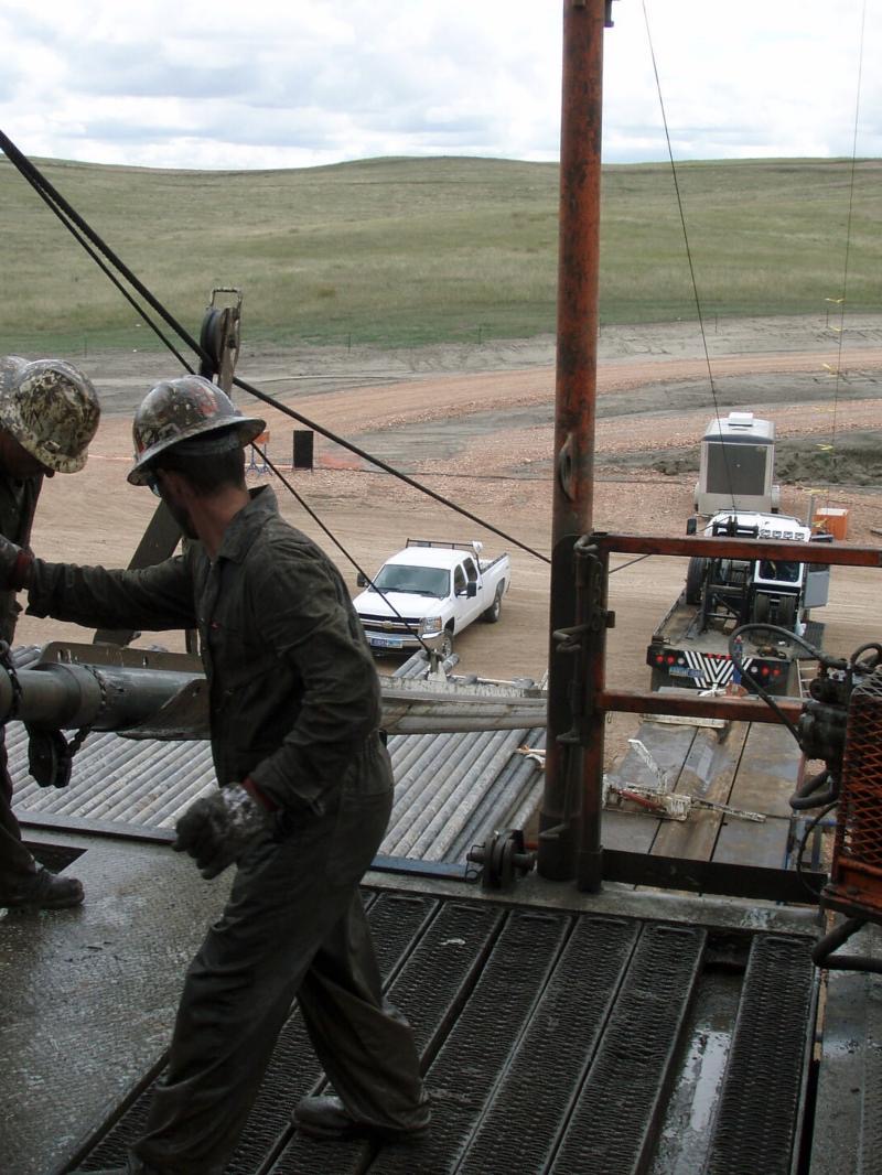 Crew member on a drilling rig floor